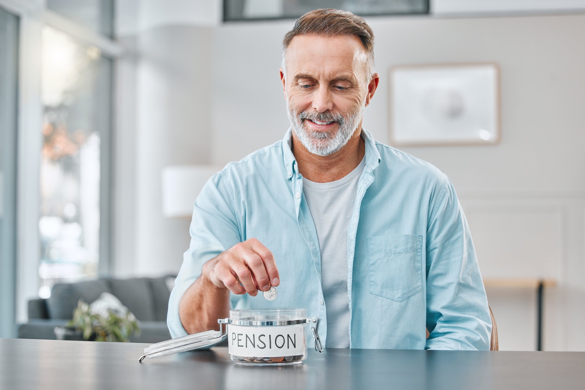 shot-of-a-mature-man-sitting-alone-at-home-and-put-2023-11-27-05-01-59-utc
